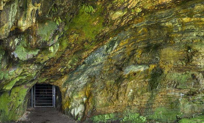 Mine entrance set in rock portal